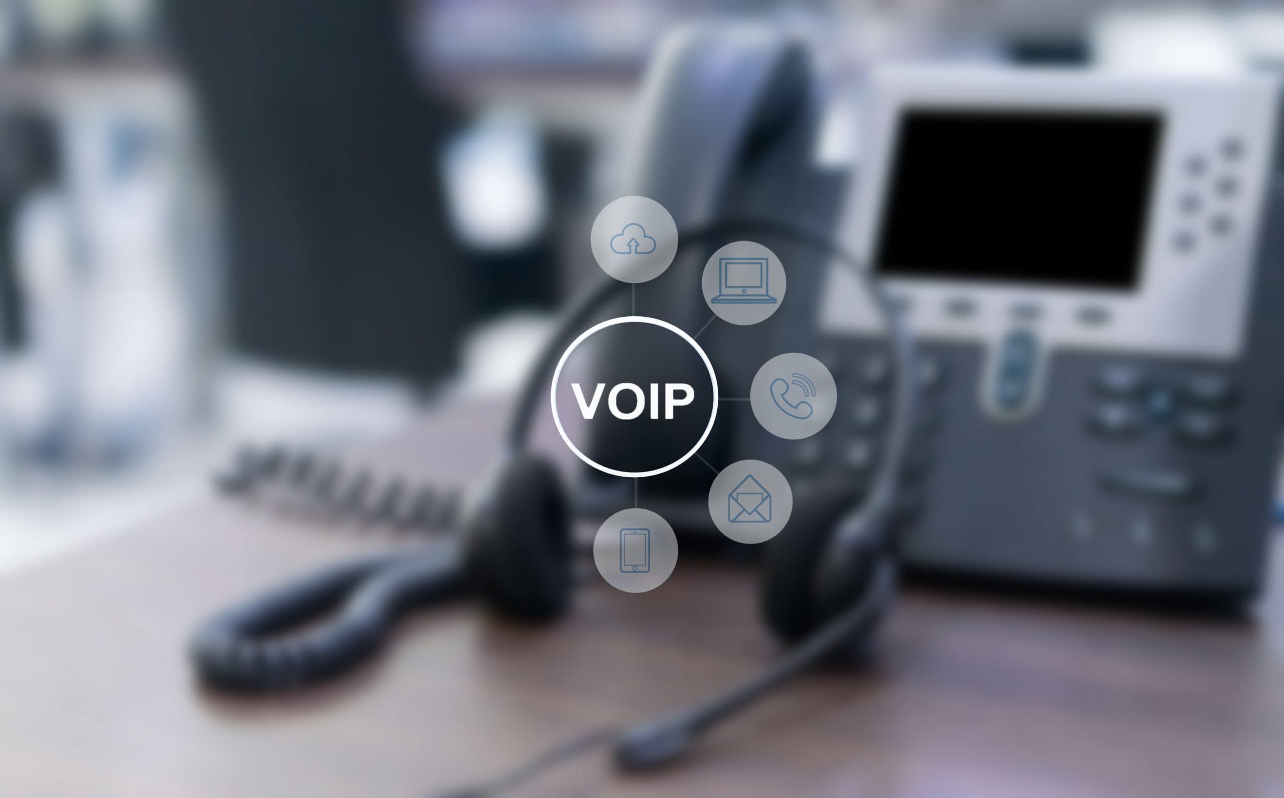 Business using a modern VoIP phone system with headsets and cloud calling